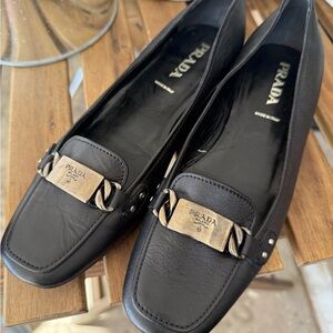 Prada Women's Black Leather Flats with Gold Accents